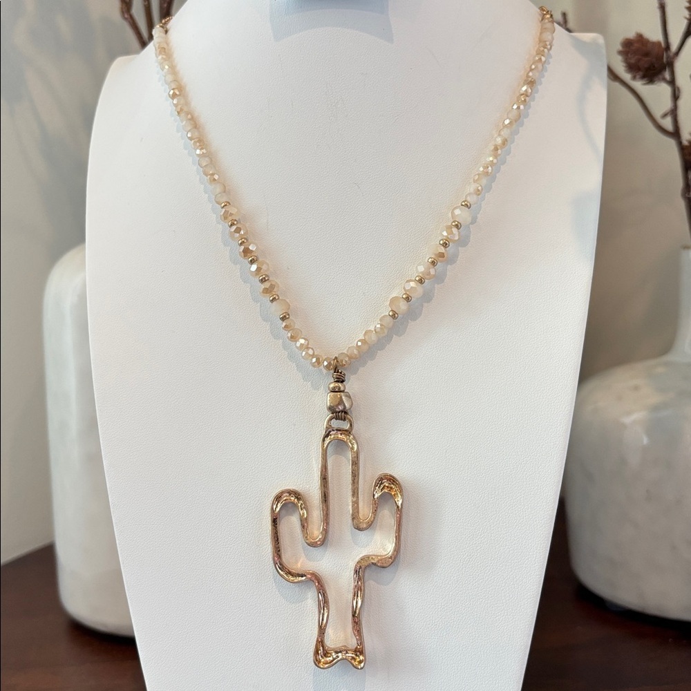 Laura Ford Goldtone Cactus Pendant & cream beveled shiny beads long necklace